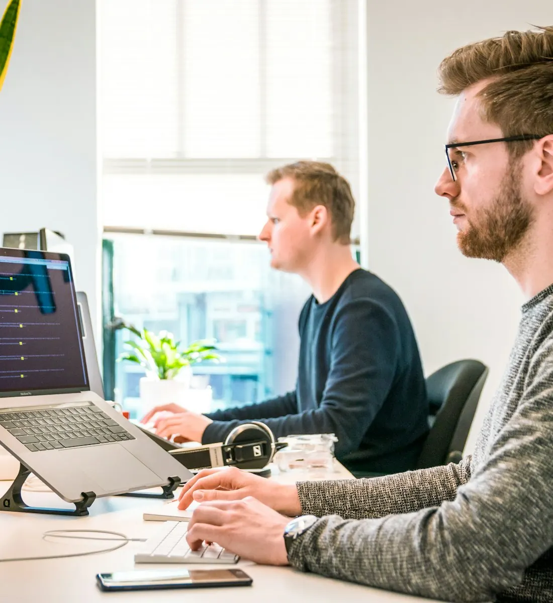 Developers reviewing technical SEO fixes on their screens
