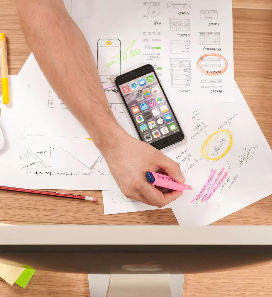 Content strategist planning articles on paper